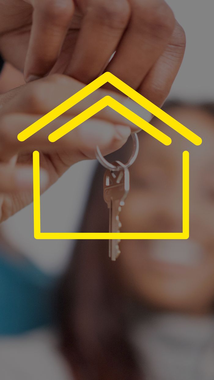 team-04 Close-up of hands holding house keys with yellow house icon overlay, representing real estate.